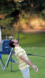 Zachary Levi balances a golf club on his chin while filming a scene in Los Angeles